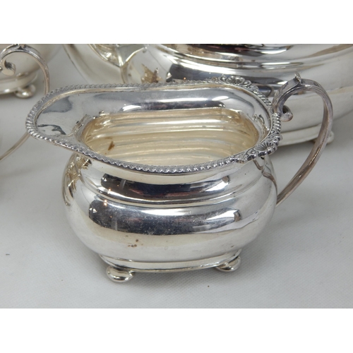 147 - A Good Quality Silver Plated Four Piece Tea Set with Gadrooned Rims: Comprising Teapot, Hot Water Po... 