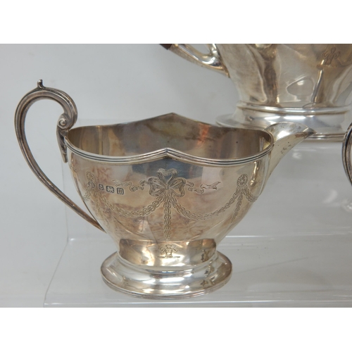 701 - Silver Three Piece Tea Set Comprising Teapot, Sugar Bowl & Milk Jug with Shaped Rims & Bow & Swag En... 