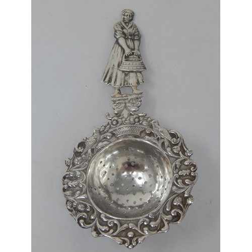 741 - A Large Late Victorian Silver Tea Strainer with Figural Handle: Bearing Import Hallmarks for Chester... 