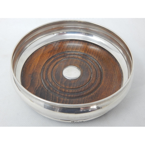 780 - Silver Bottle Coaster with Turned Wooden Base Hallmarked London 1965 by D.J Silver: 13.5cm diameter