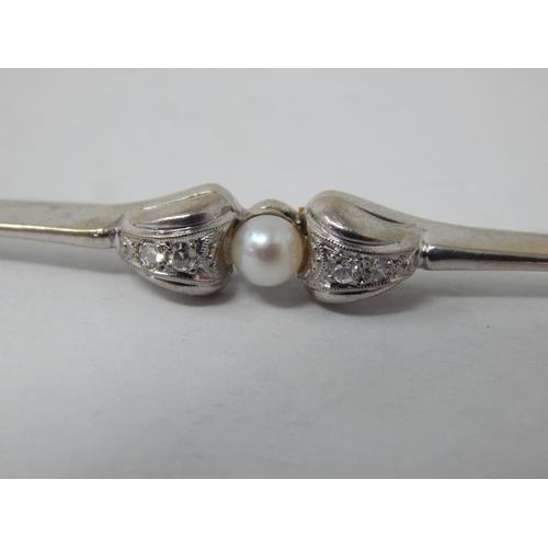 886 - 14ct White Gold Diamond & Pearl Set Brooch: Width 6.5cm: Gross weight 3.61g