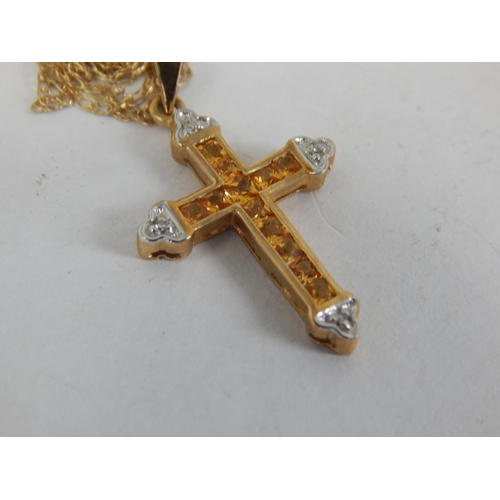 895 - 9ct Yellow Gold Gem Set Cross on 9ct Gold Chain: Gross weight 2.27g