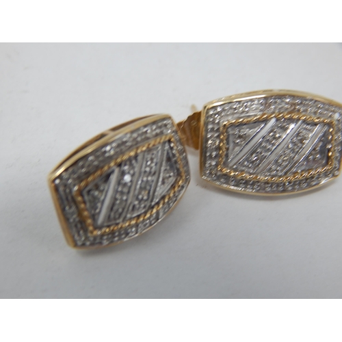 912 - A Pair of 9ct Yellow Gold Diamond Set Earrings: gross weight 3.96g