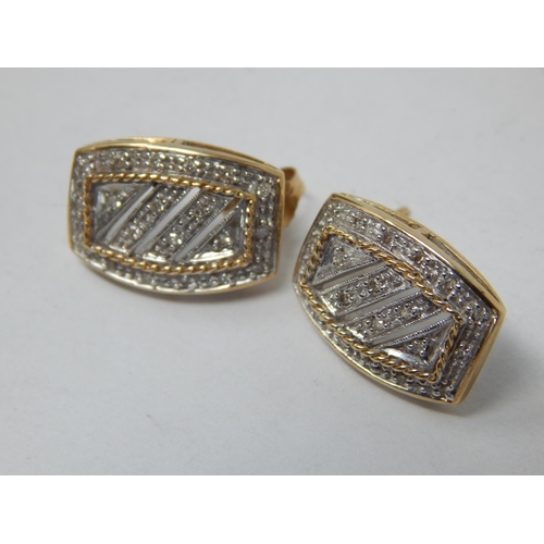 912 - A Pair of 9ct Yellow Gold Diamond Set Earrings: gross weight 3.96g