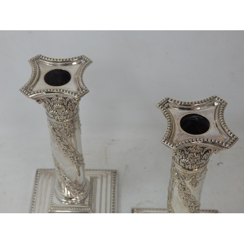 804 - A Pair of Edwardian Silver Plated Candlesticks with removeable Sconces: Height 22cm