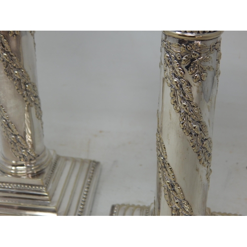 804 - A Pair of Edwardian Silver Plated Candlesticks with removeable Sconces: Height 22cm