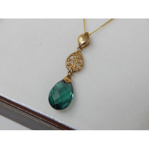 939 - 9ct Yellow Gold Gem Set Pendant on 9ct Gold Chain: Gross weight 1.93g