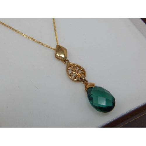 939 - 9ct Yellow Gold Gem Set Pendant on 9ct Gold Chain: Gross weight 1.93g