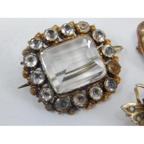 943 - Three 19th Century Yellow Metal Gem Set Brooches: Largest Measures 3.0cm x 2.8cm