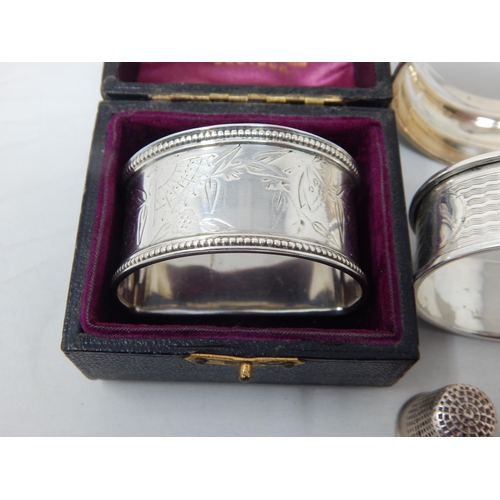 115 - 3 x Hallmarked Silver Napkin Rings together with a Hallmarked Silver Thimble by Charles Horner: Vari... 