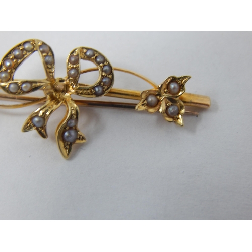 130 - 15ct Gold Bow Brooch Set with Seed Pearls: 3.6cm: Weight 2.12g