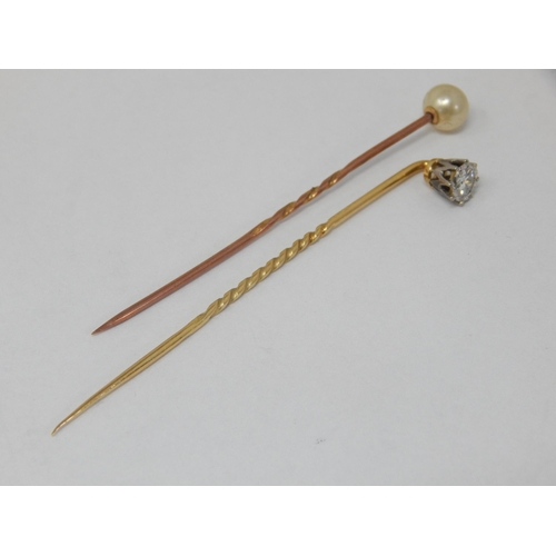 133 - Unmarked Gold Stick Pin Set with a Diamond together with a Gold Stick Pin Set with a Pearl