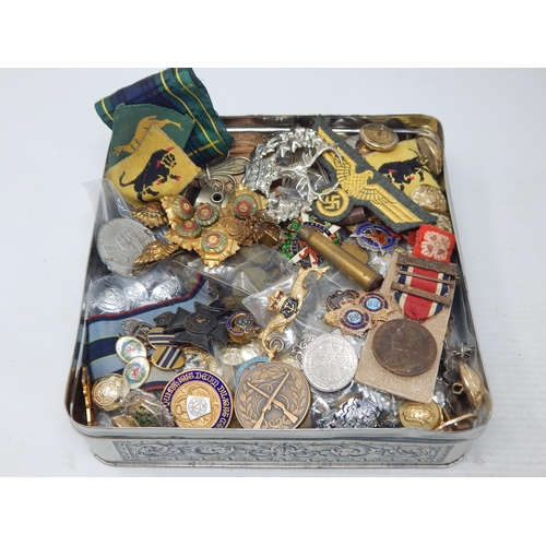 A Tin Containing a Large Quantity of Military badges, buttons etc (lot)
