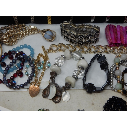 273 - A Large Collection of Costume Jewellery Including Pendant Necklaces, Chains, Bracelets, Bangles, Ear... 