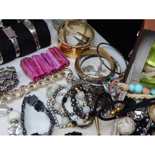 273 - A Large Collection of Costume Jewellery Including Pendant Necklaces, Chains, Bracelets, Bangles, Ear... 