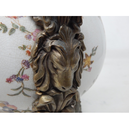 468 - Huge Porcelain Ewer Adorned with Putti Grasping a Garland of Flowers Above Rampant Hounds. The Porce... 