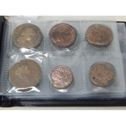 92 - A Large Quantity of Roman & Ancient Coins contained in two coin albums together with reference books... 