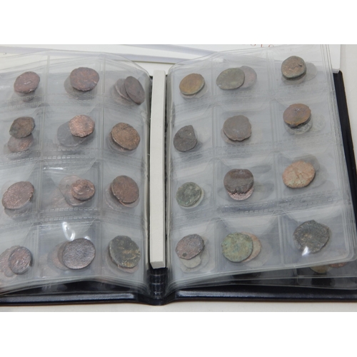 92 - A Large Quantity of Roman & Ancient Coins contained in two coin albums together with reference books... 