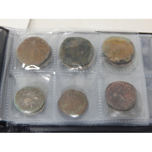 92 - A Large Quantity of Roman & Ancient Coins contained in two coin albums together with reference books... 