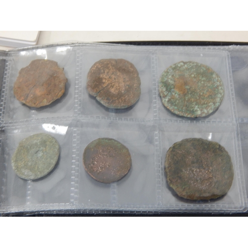 92 - A Large Quantity of Roman & Ancient Coins contained in two coin albums together with reference books... 