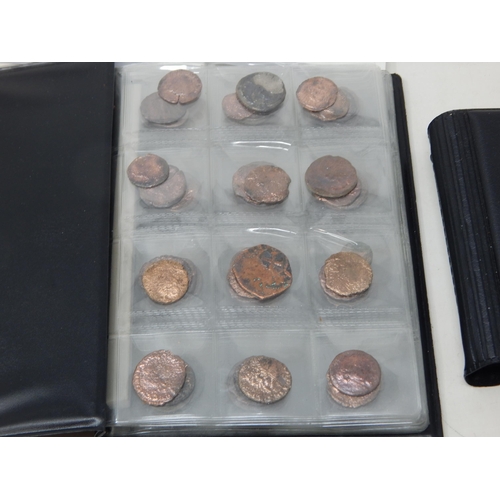 92 - A Large Quantity of Roman & Ancient Coins contained in two coin albums together with reference books... 