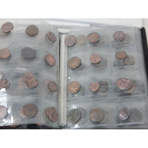 92 - A Large Quantity of Roman & Ancient Coins contained in two coin albums together with reference books... 