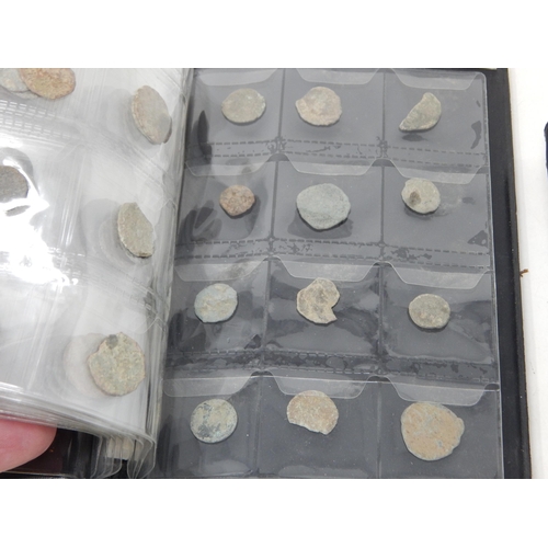 92 - A Large Quantity of Roman & Ancient Coins contained in two coin albums together with reference books... 