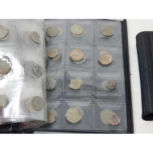 92 - A Large Quantity of Roman & Ancient Coins contained in two coin albums together with reference books... 