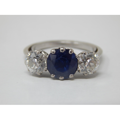 132 - Platinum Set Diamond & Sapphire Ring: The Central Sapphire estimated @ 1.50cts between Two Diamonds ... 