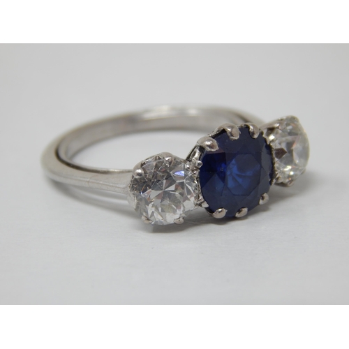 132 - Platinum Set Diamond & Sapphire Ring: The Central Sapphire estimated @ 1.50cts between Two Diamonds ... 