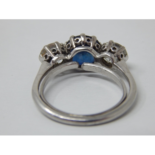 132 - Platinum Set Diamond & Sapphire Ring: The Central Sapphire estimated @ 1.50cts between Two Diamonds ... 