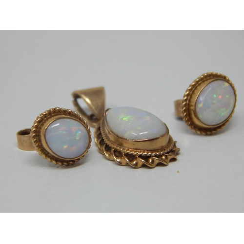 134 - 9ct Yellow Gold Opal Pendant together with a pair of matching 9ct Gold Opal Earrings: Gross weight 3... 