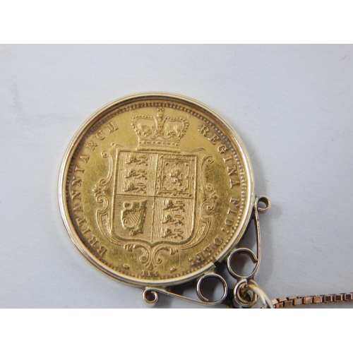 141 - QV 1873 Shield Back Half Sovereign in 9ct Gold Mount on 9ct Gold Chain: Gross weight 8.3g