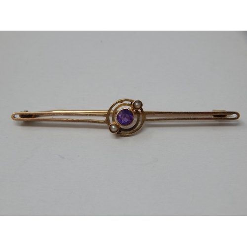 142 - Edwardian 15ct Gold Bar Brooch Set with an Amethyst & Seed Pearls: Length 5cm: gross weight 2.6g