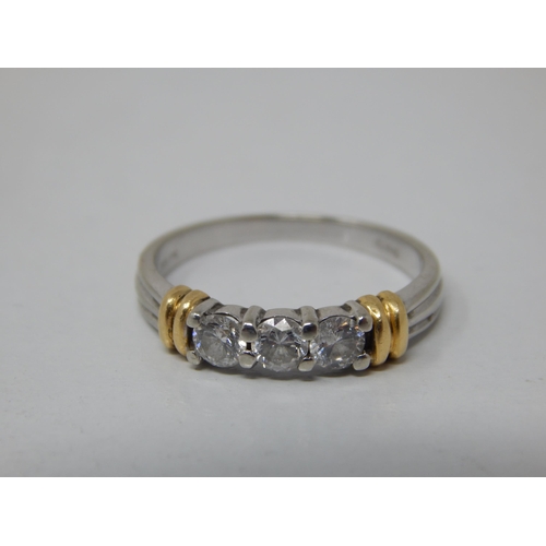 155 - 18ct White Gold 3 Stone Diamond Ring with Yellow Gold Banding: The Brilliant Cut Diamonds estimated ... 