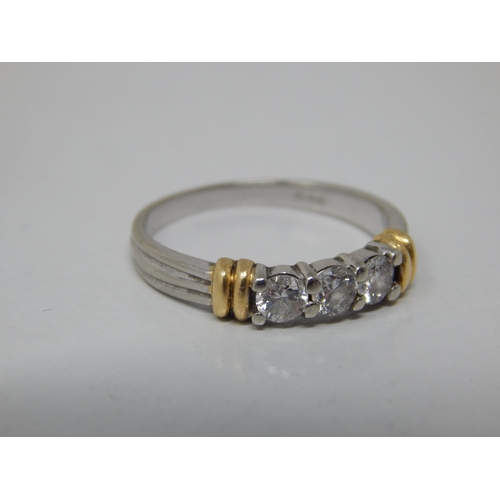 155 - 18ct White Gold 3 Stone Diamond Ring with Yellow Gold Banding: The Brilliant Cut Diamonds estimated ... 