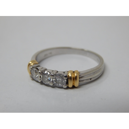 155 - 18ct White Gold 3 Stone Diamond Ring with Yellow Gold Banding: The Brilliant Cut Diamonds estimated ... 