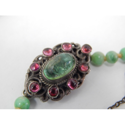 169 - Early 20th Century Graduated Jade Bead Necklace with a White Metal Clasp Set with a Central Polished... 