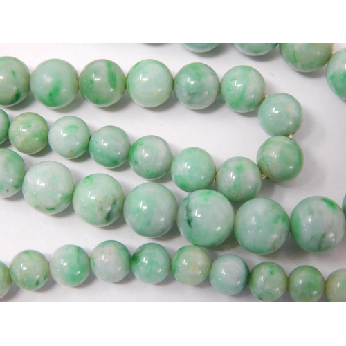 169 - Early 20th Century Graduated Jade Bead Necklace with a White Metal Clasp Set with a Central Polished... 