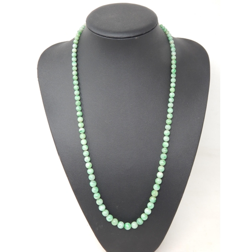 169 - Early 20th Century Graduated Jade Bead Necklace with a White Metal Clasp Set with a Central Polished... 