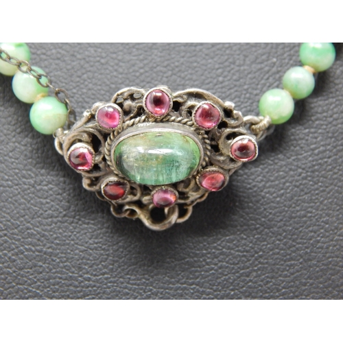 169 - Early 20th Century Graduated Jade Bead Necklace with a White Metal Clasp Set with a Central Polished... 