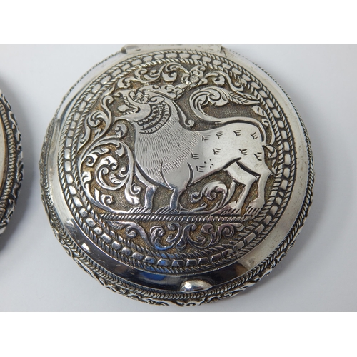 195 - Two Indian Silver Tobacco Boxes with Hinged Lids Depicting Animals: 6.4cm diameter: Weight 120g