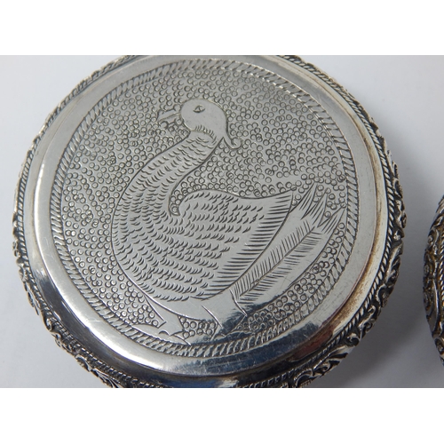 195 - Two Indian Silver Tobacco Boxes with Hinged Lids Depicting Animals: 6.4cm diameter: Weight 120g