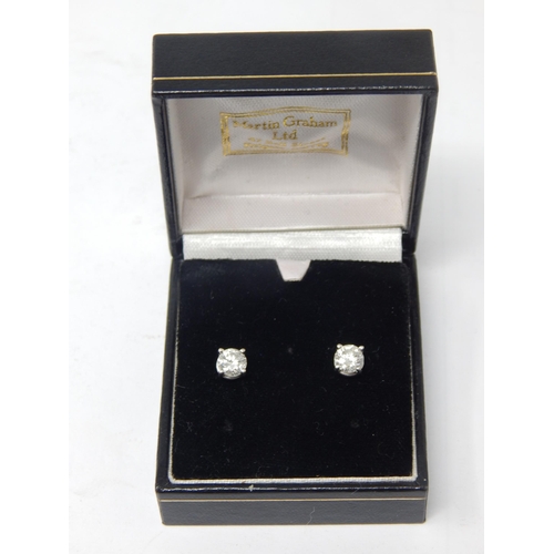 A Pair of Diamond Solitaire Earrings: Estimated Total Diamond Weight 1.0ct: Set in 18ct White Gold with Butterfly fastenings.