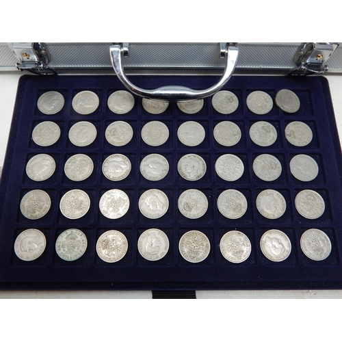 64 - Steel coin collectors case containing trays full of collectable pre-Decimal coinage