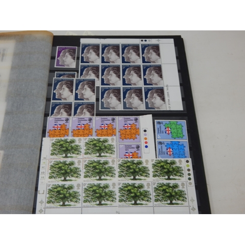 94 - Abria Stock Book containing a large quantity of Great Britain Mint QEII blocks & sets to 1975 inc ma... 