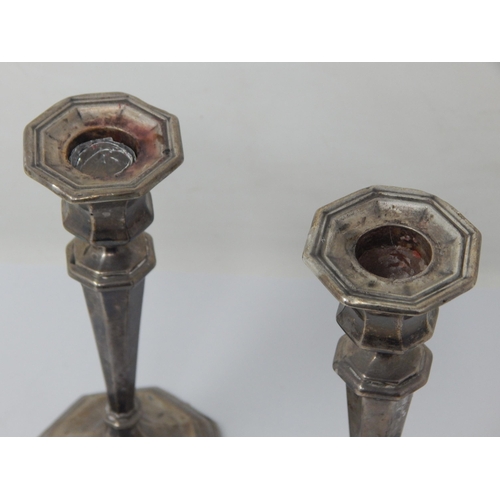 115 - A Pair of Silver Candlesticks with weighted bases: Hallmarked Birmingham 1919 by William Hutton & So... 