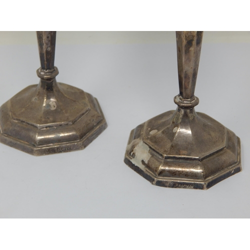 115 - A Pair of Silver Candlesticks with weighted bases: Hallmarked Birmingham 1919 by William Hutton & So... 