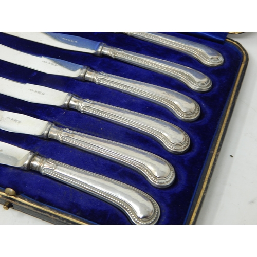 129 - A Set of Antique Silver handled Pistol Grip Knives: Hallmarked Birmingham 1919 in Fitted Case