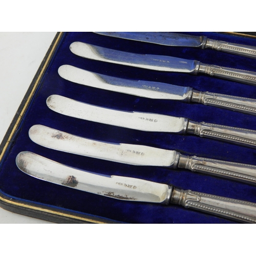 129 - A Set of Antique Silver handled Pistol Grip Knives: Hallmarked Birmingham 1919 in Fitted Case